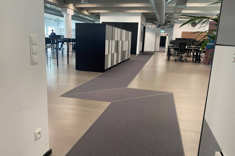 1800 m² tæppeløbere fra Fletco Carpets sikrer bedre akustik og et godt indeklima