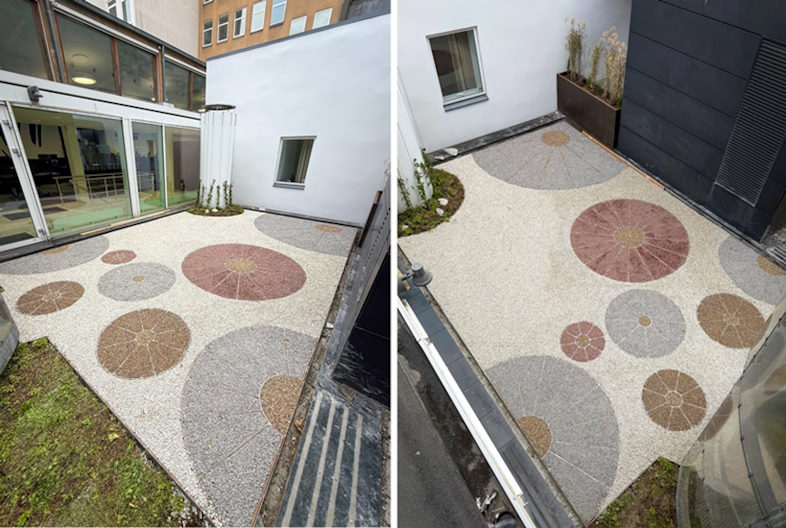 Kreativ brug af overfladebelægning i gårdmiljø i Aarhus C med sten i forskellige farver